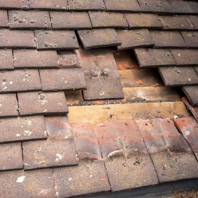 Storm-damaged roof with missing tiles exposing the battens — HomeShield emergency call-out in Dorset