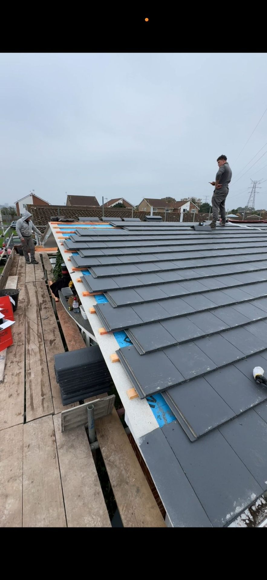 HomeShield roofers installing a new pitched tile roof in Dorset